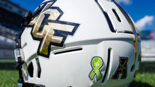 UCF White Helmet Inside the Bounce House